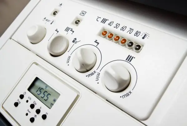 Central heating boiler panel. The controls on a domestic central heating and hot water combination boiler